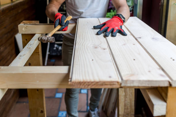 istock Man building a handmade wooden table with pine boards 1394461994