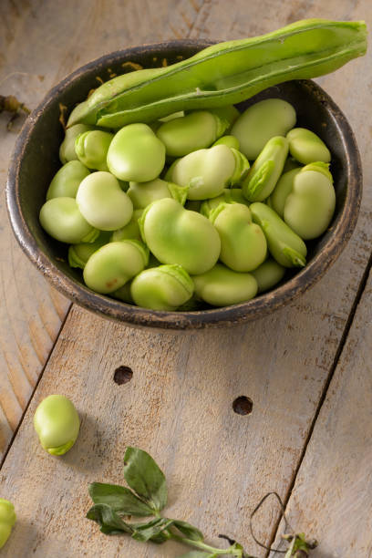istock Fresh and raw green broad beans 1394463649