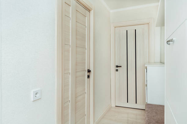 istock white apartment hallway with doors to rooms 1394464380