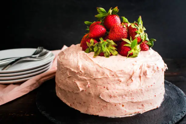 Fresh strawberry cake with cream cheese frosting viewed from above