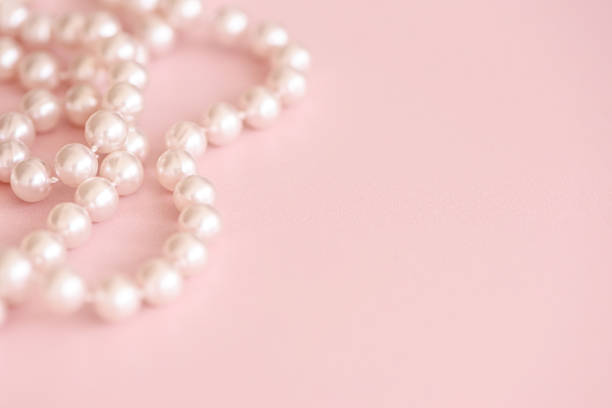 istock desktop mockup with pearls on pink 1394466612