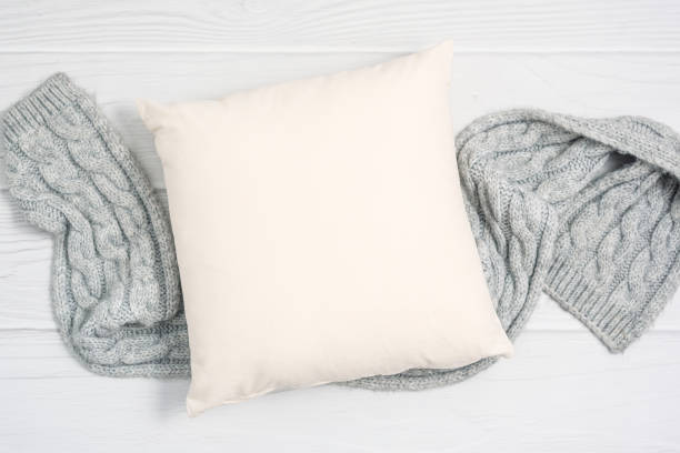 istock White blank pillow mockup, cozy winter composition 1394467349