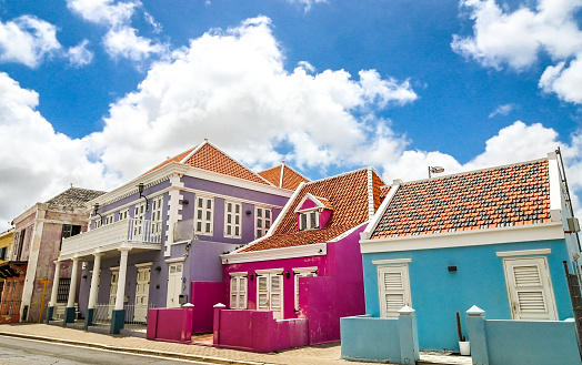 Willemstad, Curacao - February 11, 2014: Colorful waterfront buildings in Willemstad historic district Punda on Curacao island. The city center is UNESCO World Heritage Site.