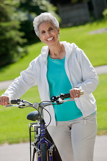 istock Senior woman with her bicycle 139447091