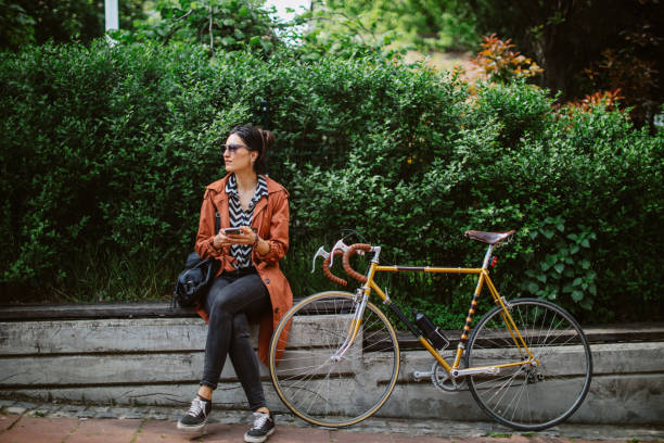 commuter stops to check the phone messages