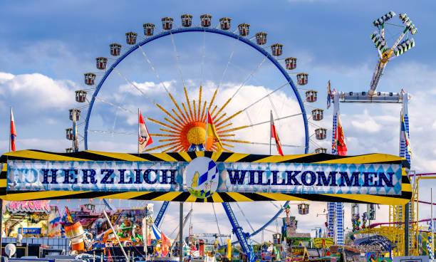 spring festival in munich - germany - amusement park oktoberfest munich chain swing ride imagens e fotografias de stock