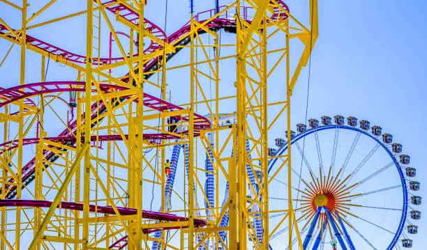 spring festival in munich - germany - amusement park oktoberfest munich chain swing ride imagens e fotografias de stock