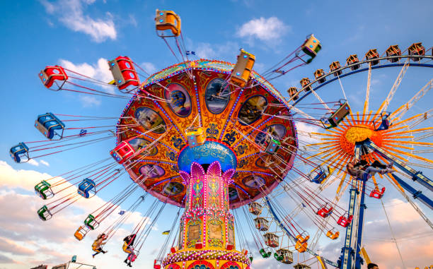 spring festival in munich - germany - amusement park oktoberfest munich chain swing ride imagens e fotografias de stock
