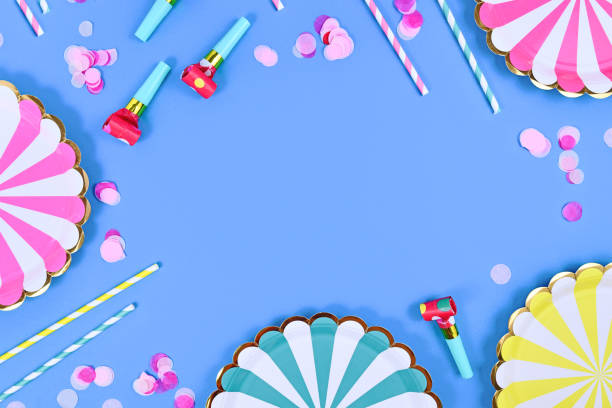 istock Party flat lay with paper plates, drinking straws and confetti 1394474731