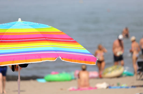 sunshade on the sandy beach and some people
