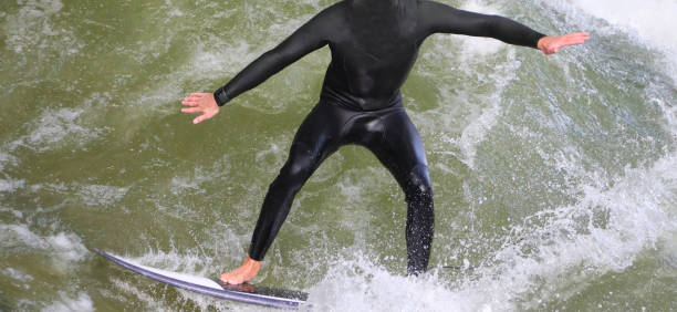 istock young surfer on the surfboard in the water 1394475837