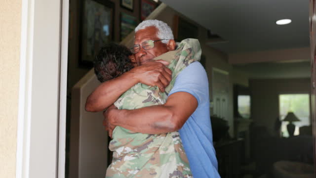 Father Hugging his Daughter who has returned home