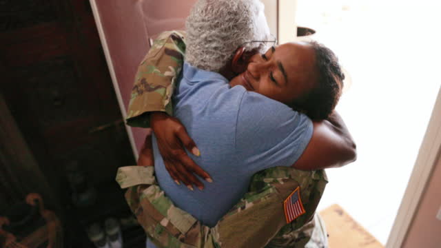 Father Hugging his Daughter who has returned home