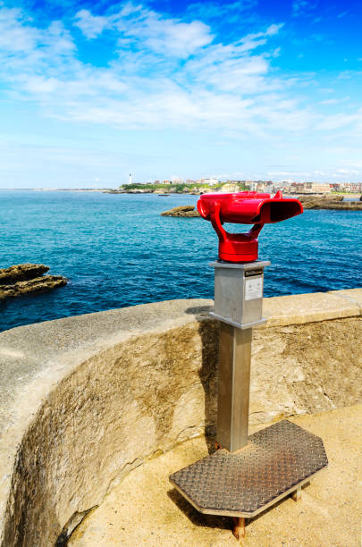 istock Binoculars and lighthouse at Hainsart point at Biarritz 1394481434