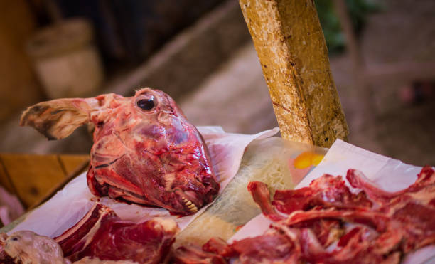 istock Sheep head and meat at a market 1394481516
