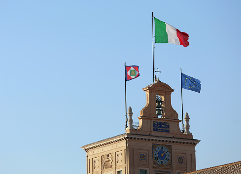 Rome, RM, Italy - August 15, 2020: Three big flags on the Quirinale Palace house of Italian President of Republic