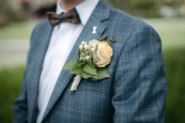 istock Groom's boutonniere closeup 1394487090
