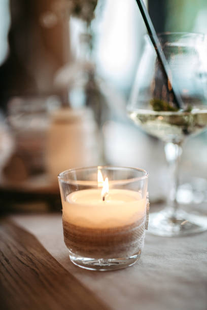 istock Burning candle as part of the table decoration at a wedding 1394488020