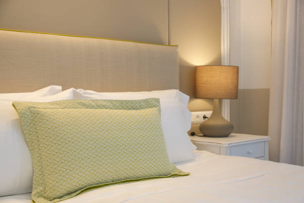 istock Cozy and elegant bedroom. King size bed with bedside lamp. 1394488044