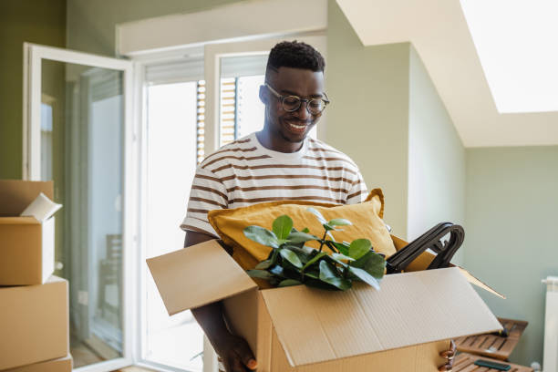 istock Young man moving into a new apartment 1394488111