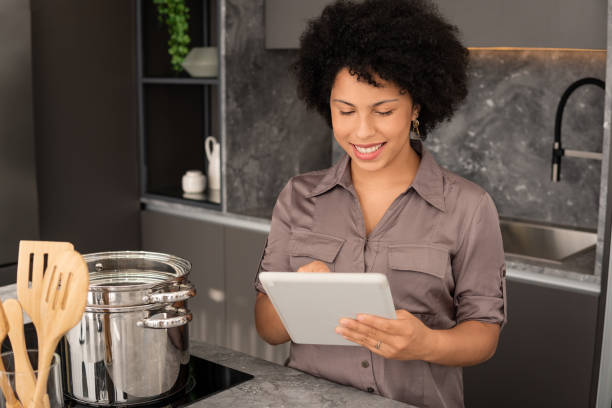 istock woman looking at tablet for recipe 1394489132