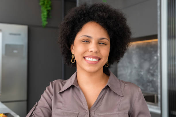 istock woman smiling in the kitchen 1394489151