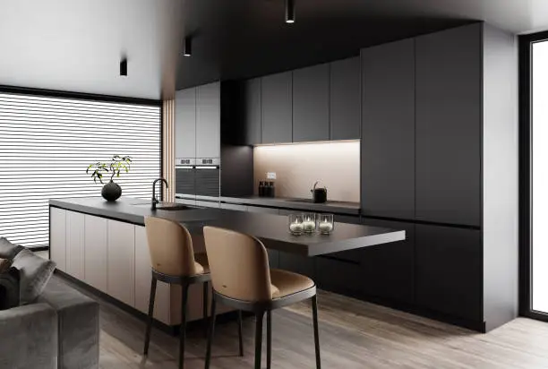 Luxury apartment with living room interior and modern minimalist kitchen with big kitchen island and stools.
Black matte cabinets with dark gold details. Black carpet. Grey sofa. Hardwood floor.  Italian style interior design. 3d rendering
