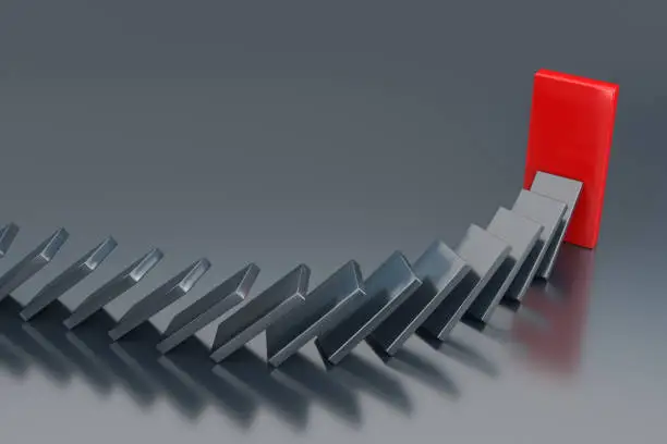 Photo of The Domino Effect in Action. 3d Rendering