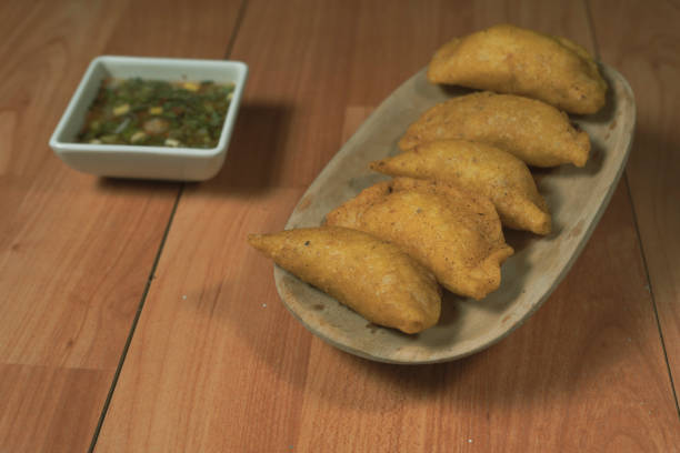 istock Colombian empanada with spicy sauce 1394495045