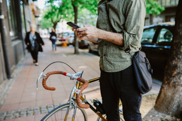 istock commuter texting on the phone on his way to work 1394496879