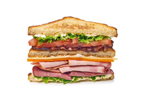 istock Half of huge club sandwich on white background 1394497778