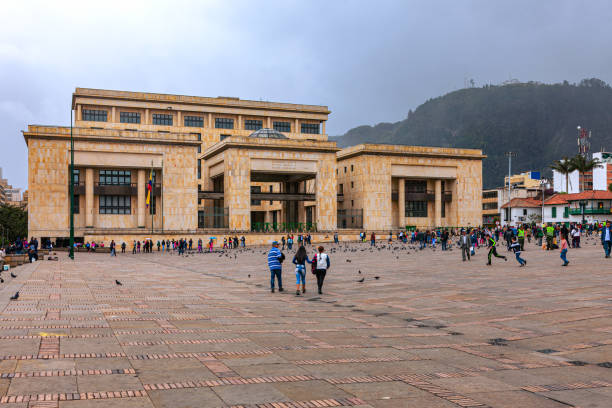 Bogota, Colombia - View Across Plaza Bolivar, To The Supreme Court Of The Country On The North SIde Of The Square Filled With Colombians Going About Their Everyday Work stock photo
