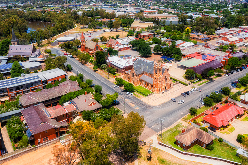 Church street and local cathedral with christian churches in Wagga Wagga city of Australia - aerial cityscape.