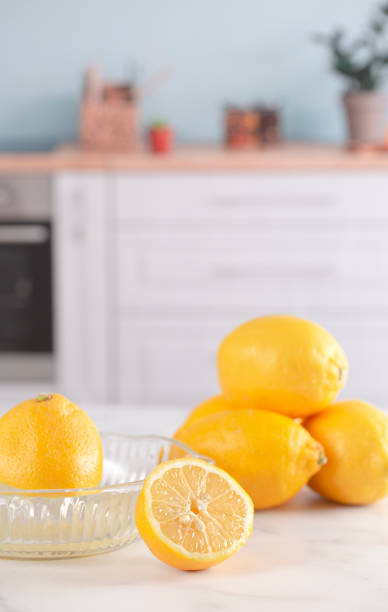 istock Lemon Being Juiced on a Kitchen Counter 1394498504