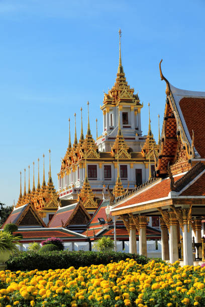 istock Buddhist temple Wat Ratchanaddaram over sunny sky in Bangkok 1394499417