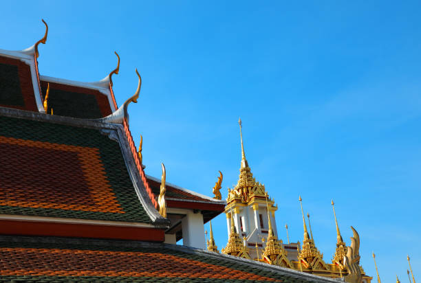 istock Buddhist temple exterior over sunny blue sky in Bangkok 1394499543