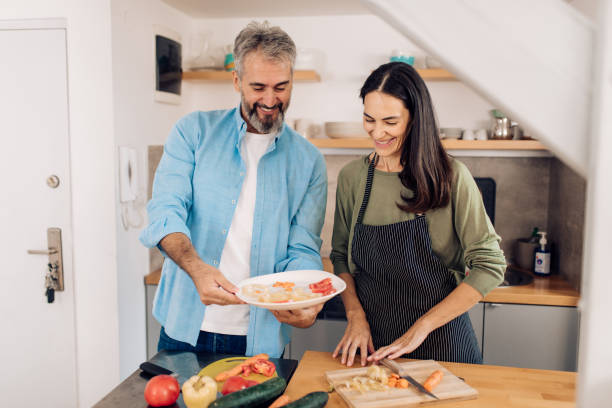 istock Happy couple making their takeaway veggie meal 1394500128