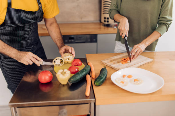 istock Happy couple making their takeaway veggie meal 1394500132