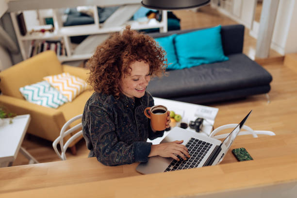 istock Redhead girl attending an online university class 1394500171