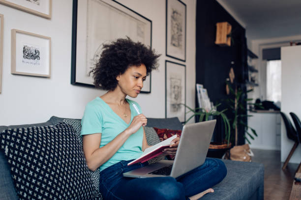 istock Young African American freelancer making plans for her business 1394500234