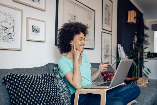 istock Young woman working online at her improvised home office 1394500255