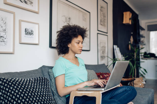 istock Young woman working online at her improvised home office 1394500257