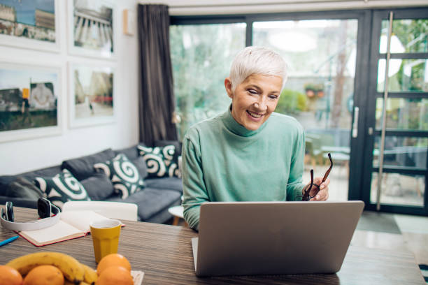 istock Senior entrepreneur working from home 1394500298