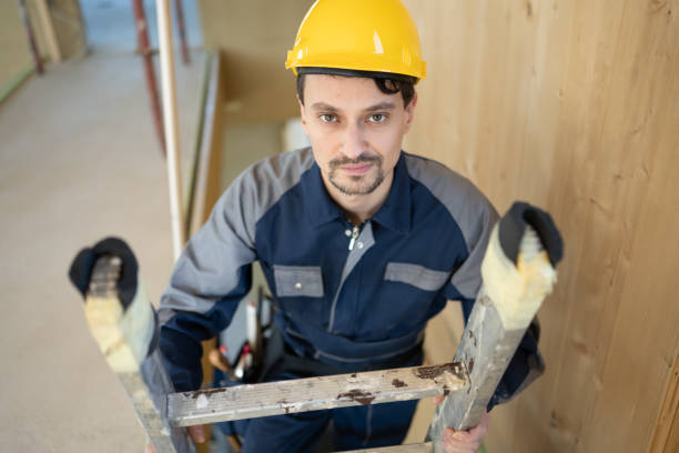 istock Building worker climbing up on ladder 1394500432