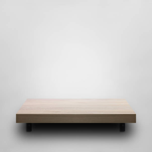 istock Wooden shelf on white concrete wall background for decorative design. 1394501614
