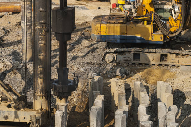 istock The pile driver hammers the pile. 1394501684