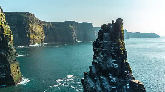 The magnitude of the Cliffs of Moher! Iconic place in Ireland in front of the ocean. Risky place where many people lost their lives in the past, now a lot of tourists love to walk all over them!