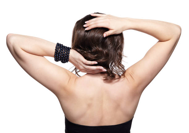 istock Brunette woman from backside on gray background 1394513271