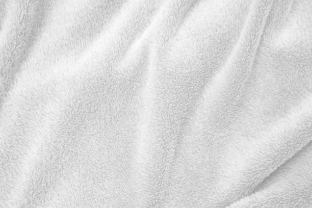 istock White clean wool texture background. light natural sheep wool. white seamless cotton. texture of fluffy fur for designers. close-up fragment white wool carpet. 1394517217