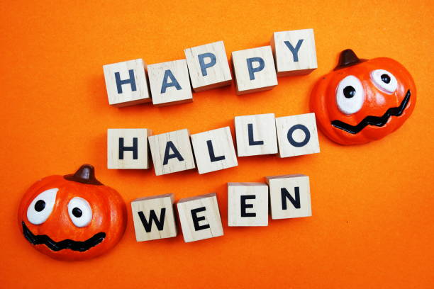 istock Happy Halloween alphabet letters top view on orange background 1394520479